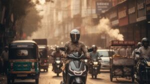 Electric scooter rider commuting on a busy Indian city road during morning rush hour