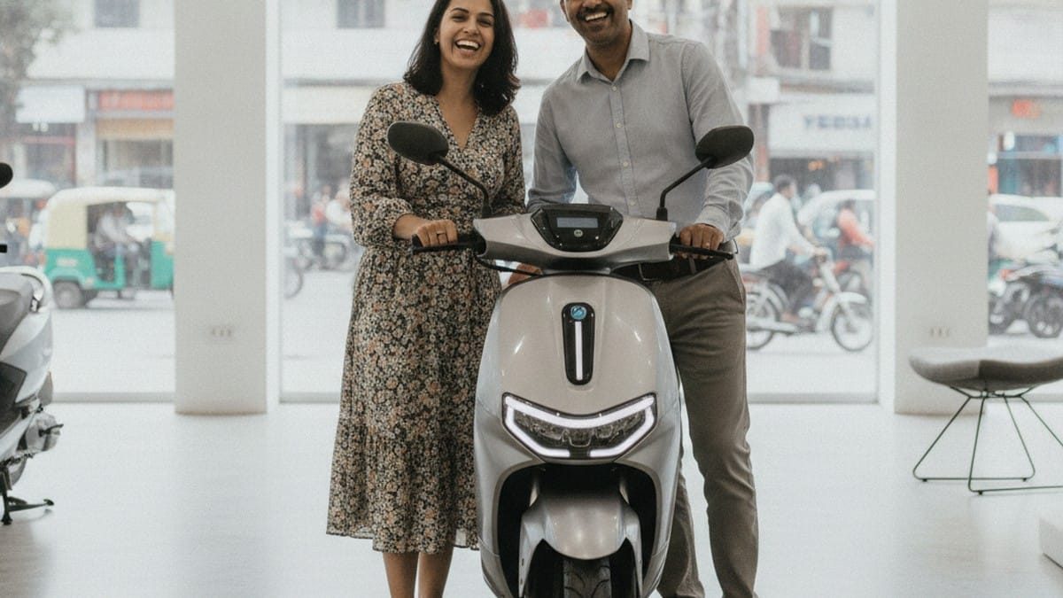 Indian couple at an electric scooter dealership benefiting from the PM E-Drive subsidy scheme